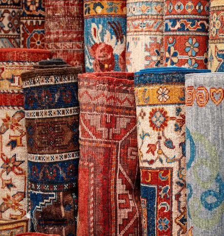 View of multiple carpets for sale at the Grand Bazaar in Istanbul, Turkey